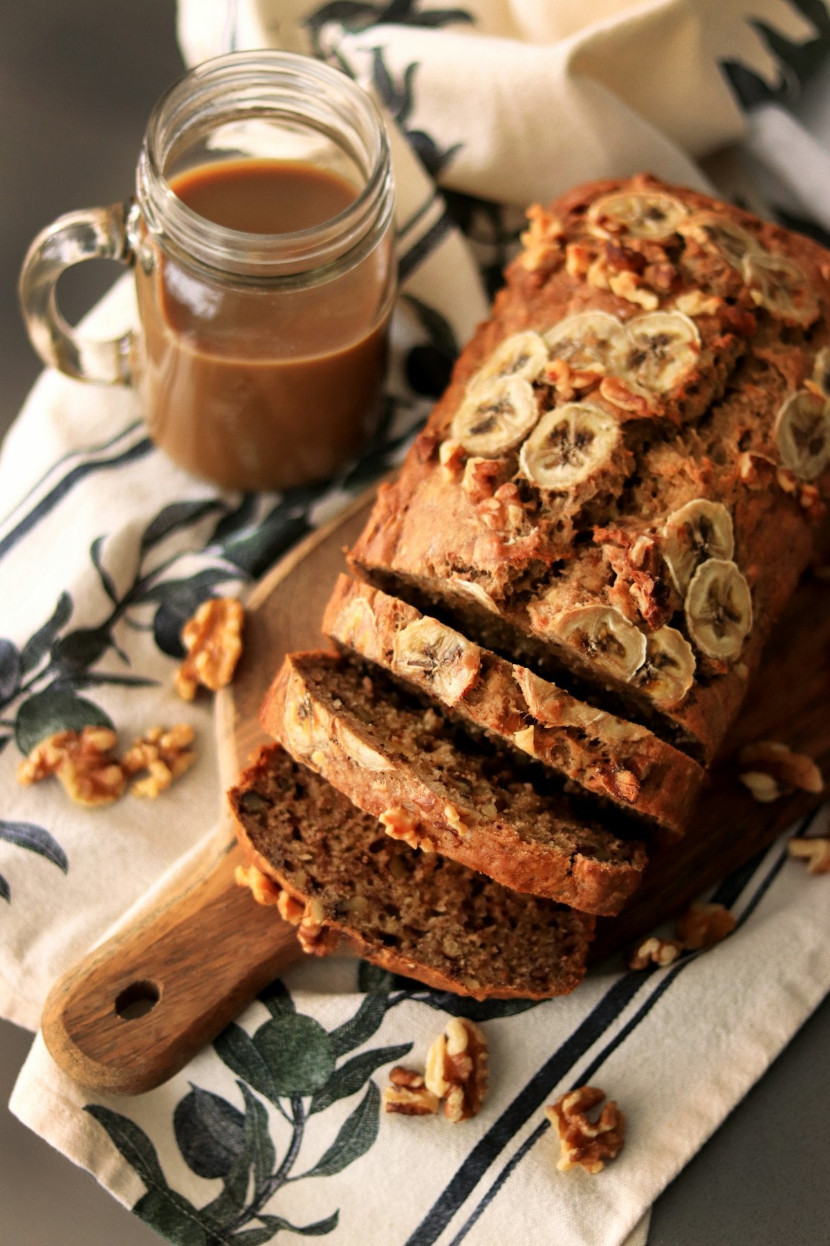 Sliced banana nut bread on cutting board